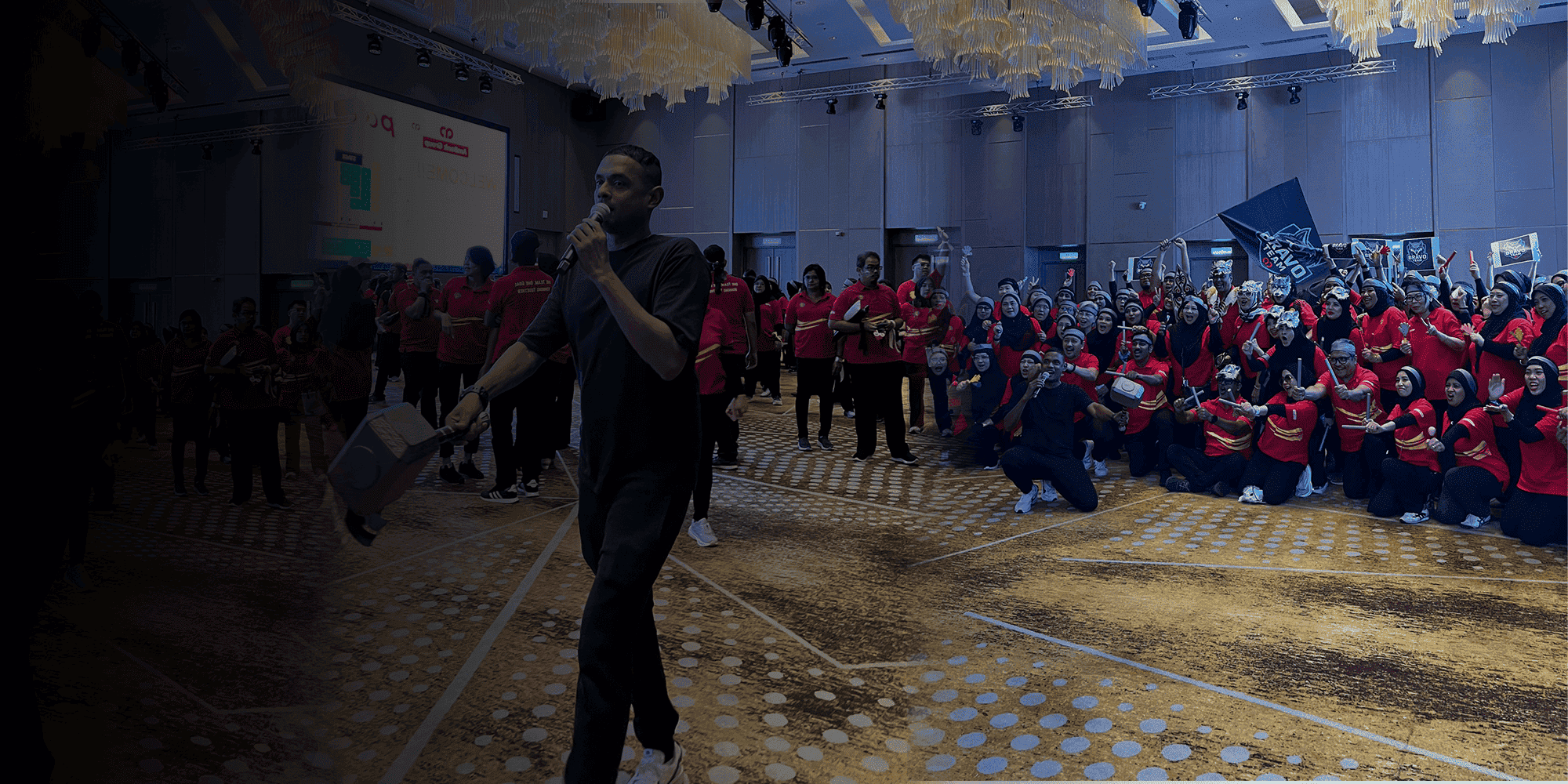 Business Warrior facilitator leading a large corporate team-building group